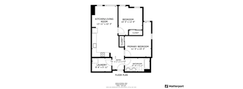 A floor plan of a home with a laundry room, kitchen/living room, and two bedrooms.