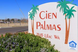 a sign for a cien palmas sign on the side of the road