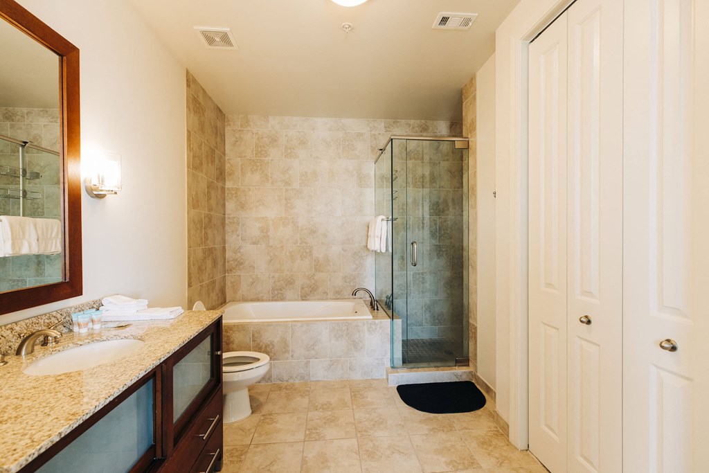 a bathroom with a shower toilet and sink at Metro67, Memphis, TN, 38103