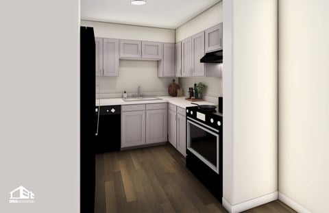 A modern kitchen with a black refrigerator and wooden floors.