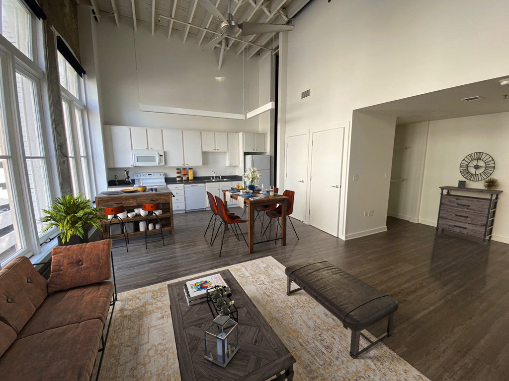 an open living room with a kitchen and dining area  at Lofts at Union Alley, Memphis, 38103