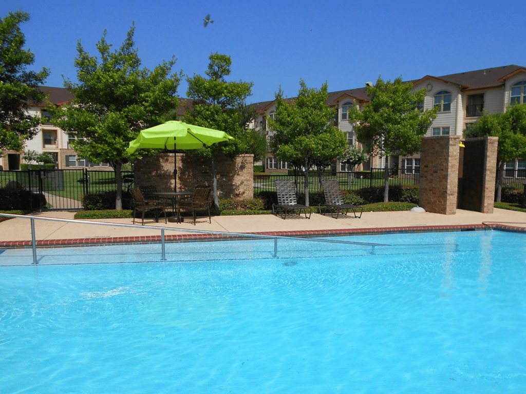 our apartments have a large swimming pool with umbrellas