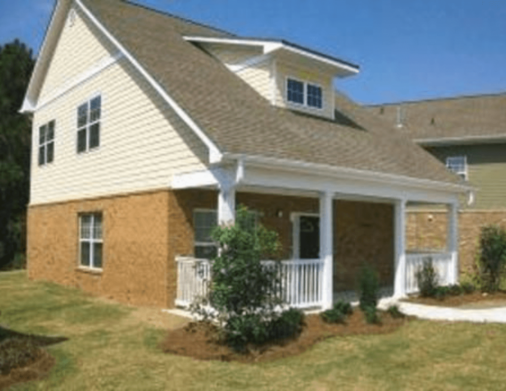 a house with a front porch and a lawn