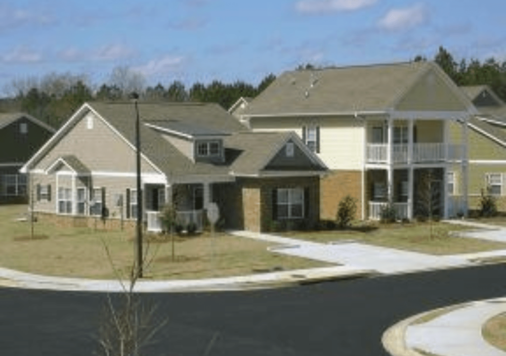 a group of houses on the side of a street
