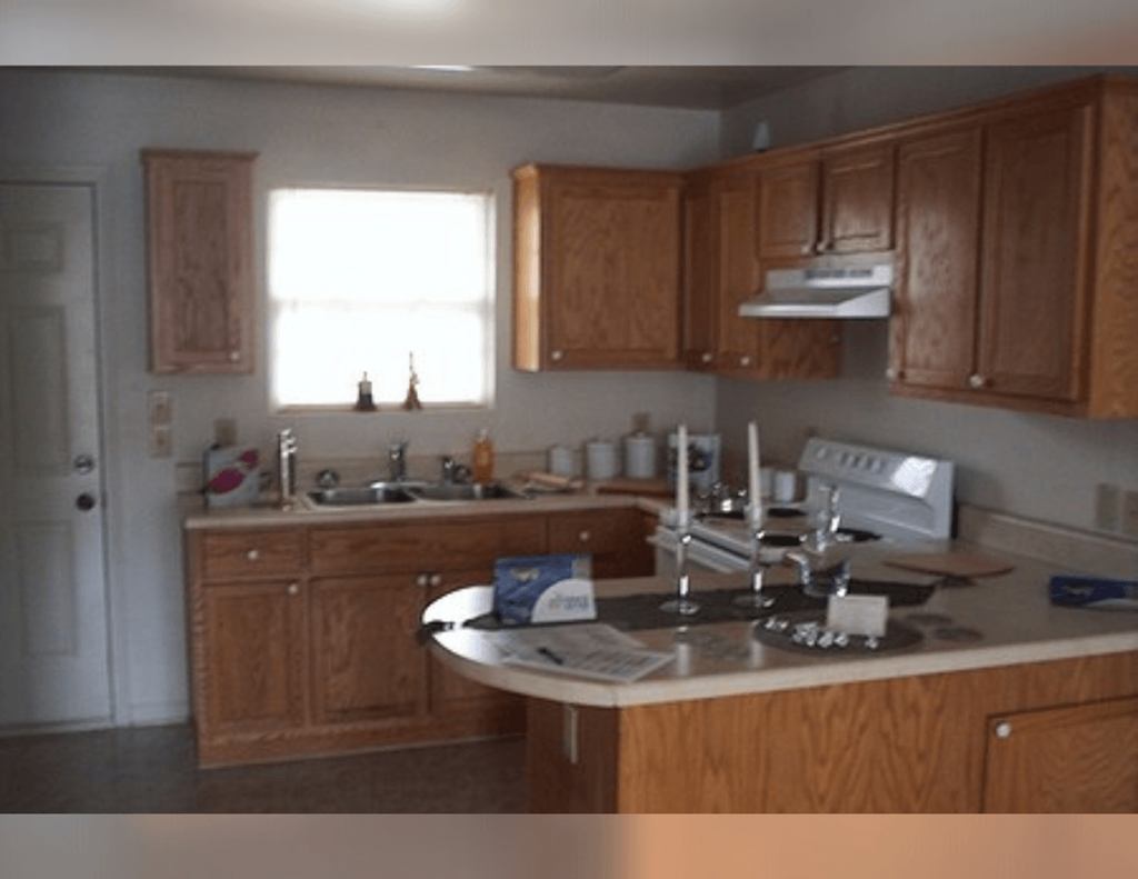 a kitchen with wooden cabinets and a sink