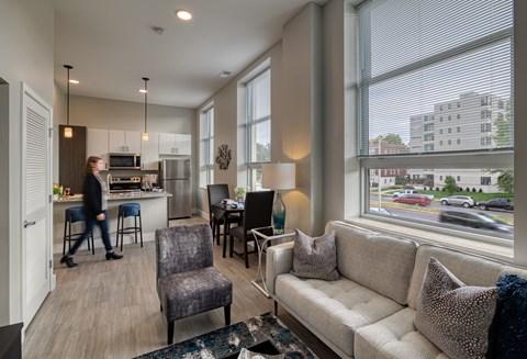 A woman walks through a modern living room.