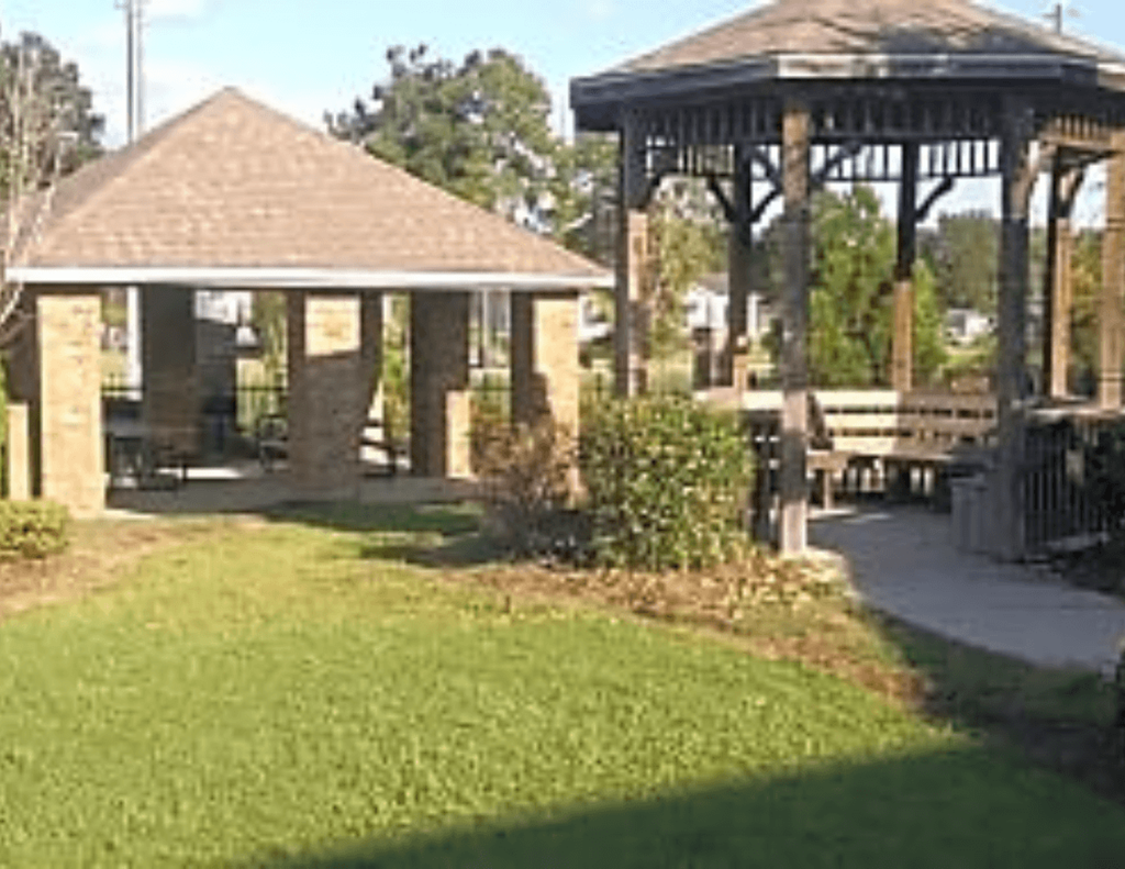 a park with a gazebo and a picnic table