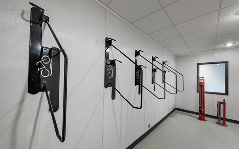 a gallery with various horseshoes hanging on the wall
