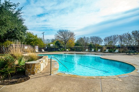 the swimming pool at the preserve at ballantyne commons apartments tx