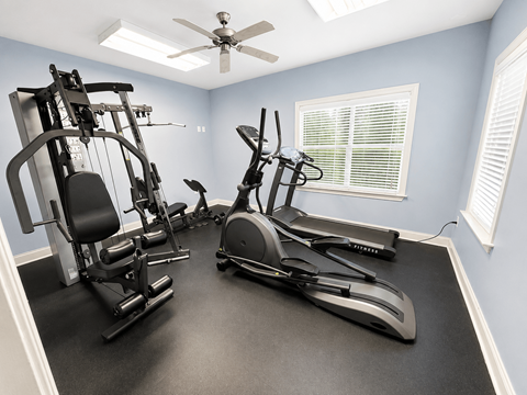 A home gym with a variety of exercise equipment.