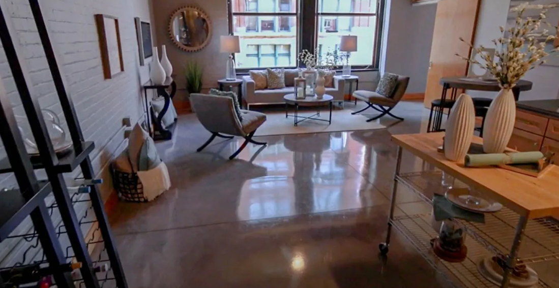 a living room with furniture and a large window