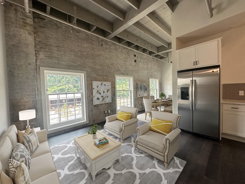 a living room with couches and a coffee table at The Mill at Prattville, Alabama, 36067