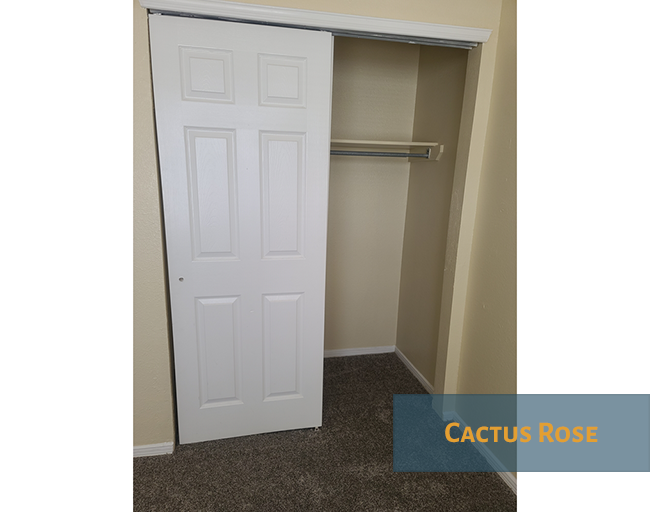 A white door is open to a hallway.