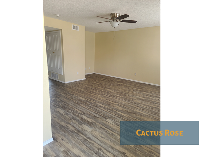 A room with Cactus Rose flooring and a ceiling fan.
