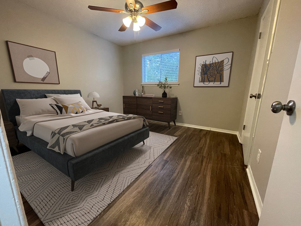 a bedroom with a bed and a ceiling fan at The Junction, Tennessee