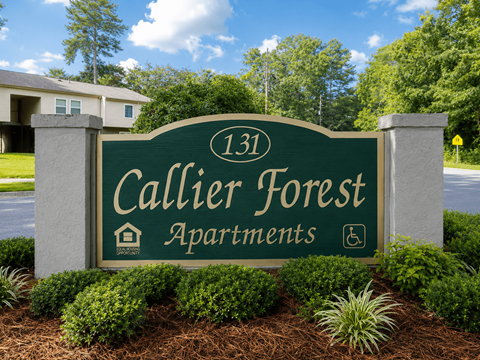 A sign for Callier Forest Apartments is displayed in front of a building.