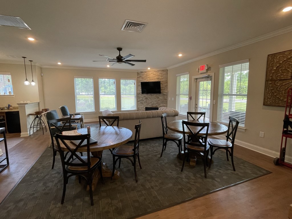 a dining room and living room with a couch and a table