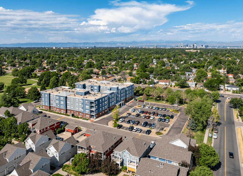 A large building with a parking lot in front of it.