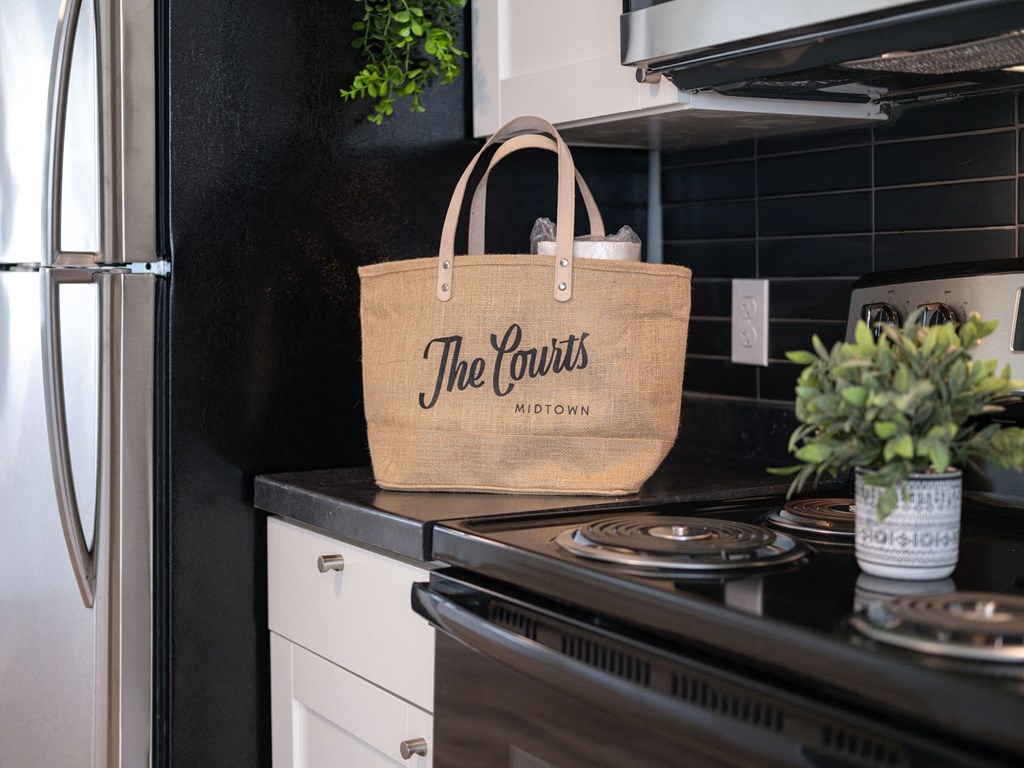 a bag sitting on a stove in a kitchen at The Courts Midtown, Tennessee