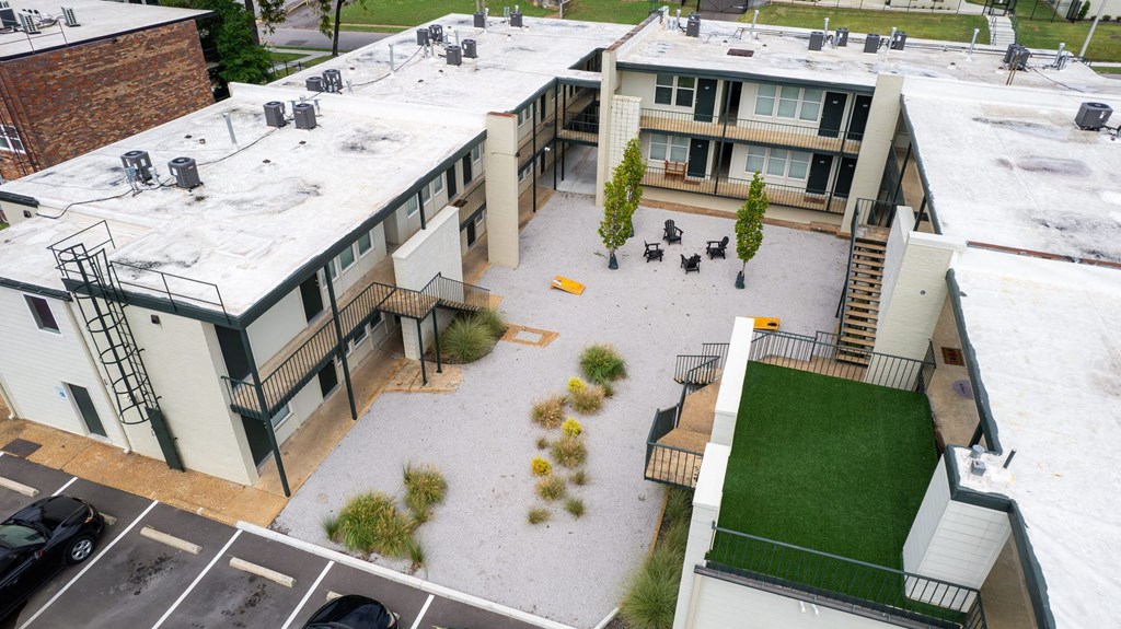 an aerial view of the courtyard of a building with green grass at The Courts Midtown, Memphis, TN
