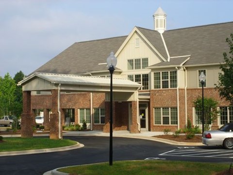 A building with a white steeple on top of it.