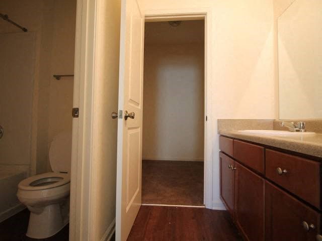a bathroom with a toilet and a sink