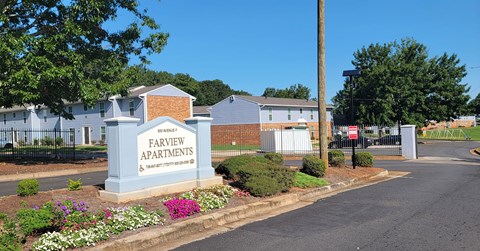 The entrance to Farview Apartments is surrounded by a well-maintained garden.