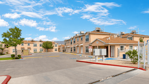A sunny day at the apartment complex with clear blue skies.