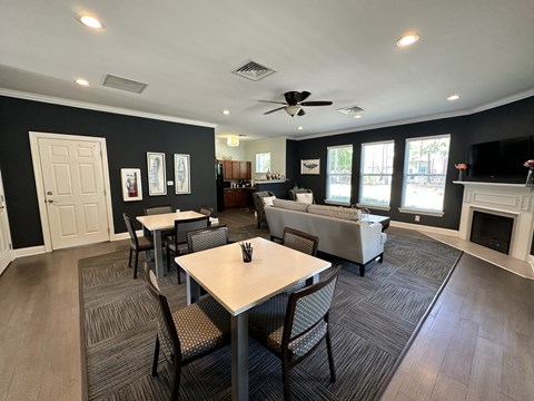 a living room with a table and chairs and a couch