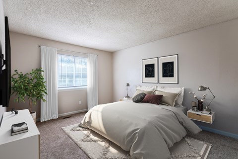 A bedroom with a large bed and a flat screen TV.