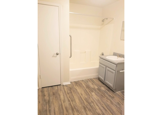 a bathroom with a sink and a bath tub