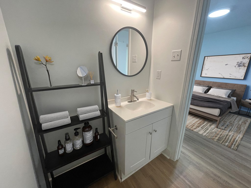 a small bathroom with a sink and a mirror at The Courts Midtown, Memphis, Tennessee