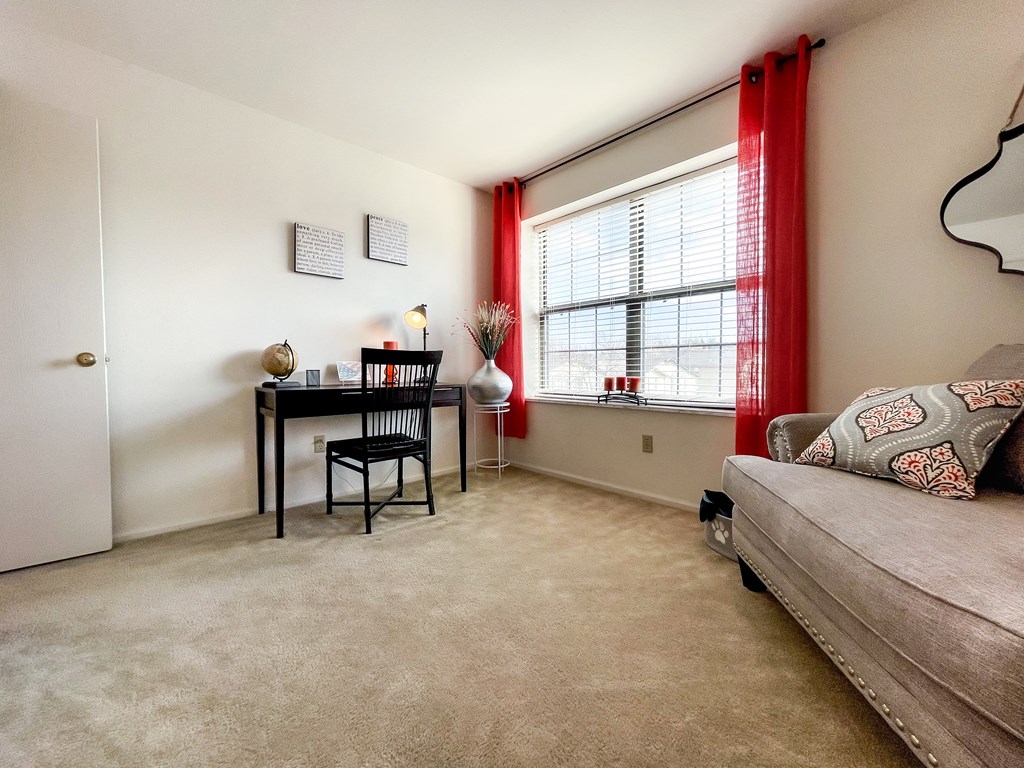 our apartments have a living room with a couch and a desk