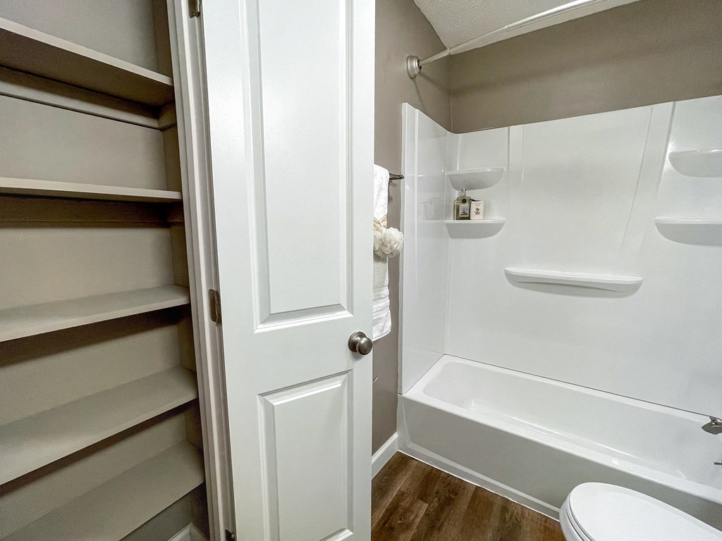 a small bathroom with a shower and a toilet