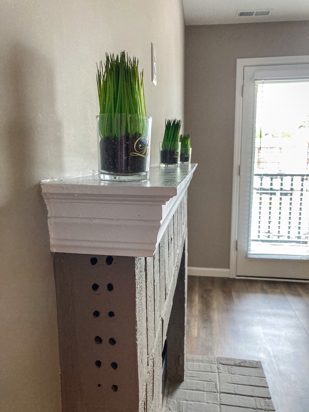 a side table with potted plants on top of it
