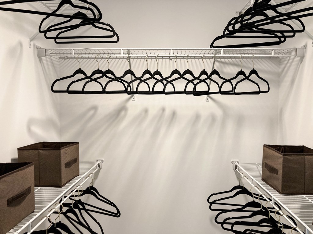a shoe rack with shoes on it in a closet