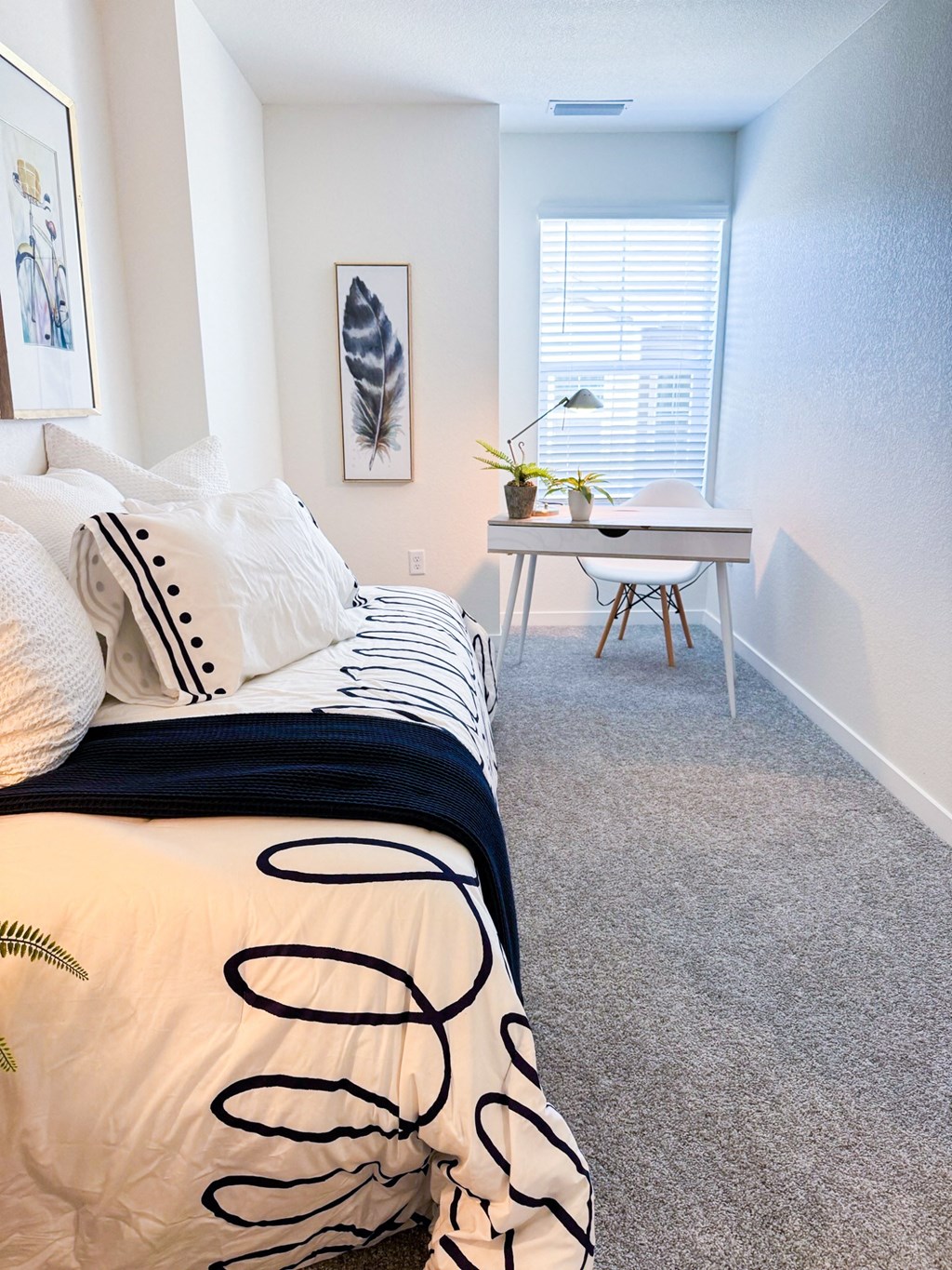 an example of a bedroom with a bed and a desk