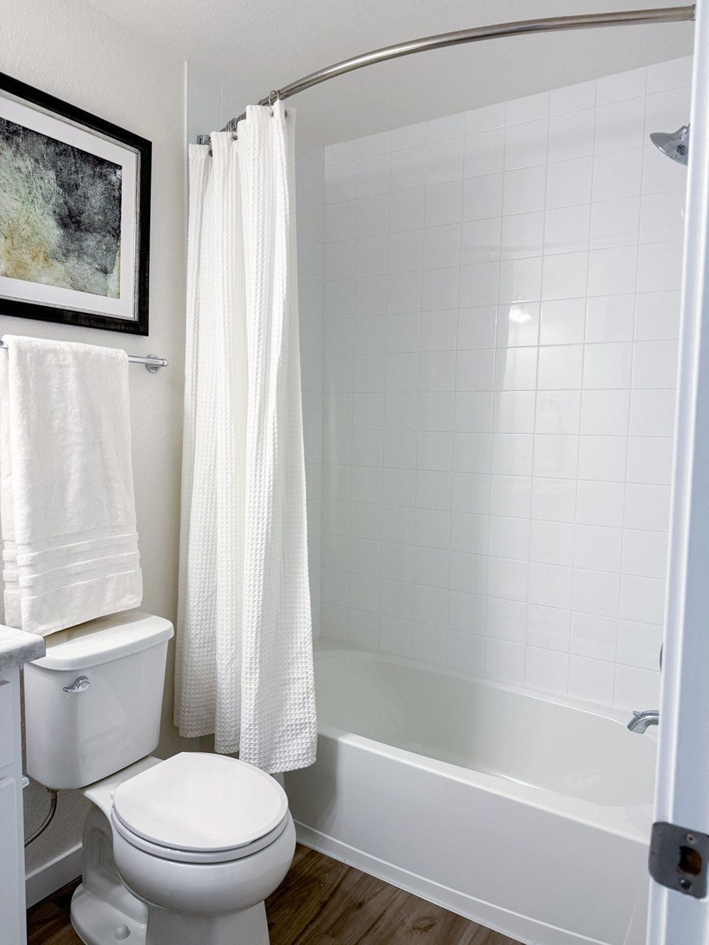a bathroom with a toilet and a bath tub