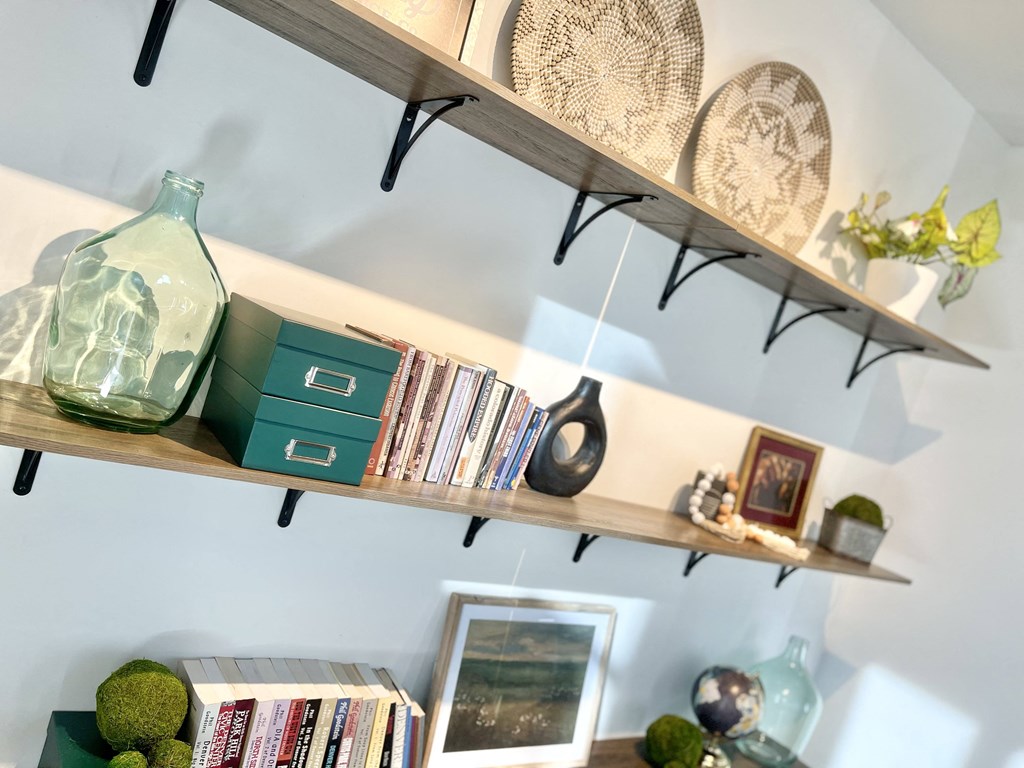 a shelf with books and other items on it