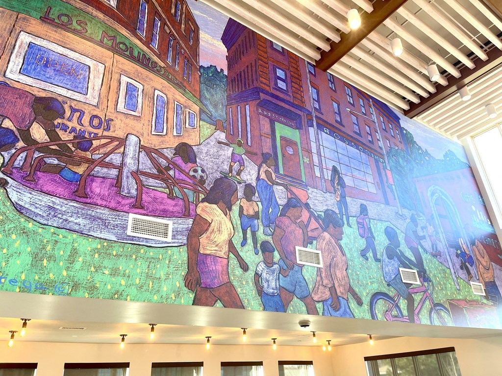 a mural on the wall of the lobby of a building