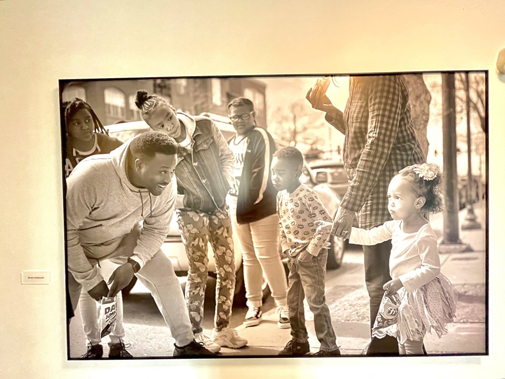 a picture of a group of people standing on a street