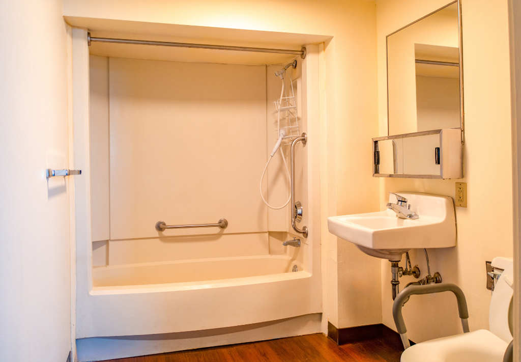 a bathroom with a bathtub and a sink