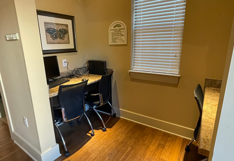 a home office with a desk and a computer
