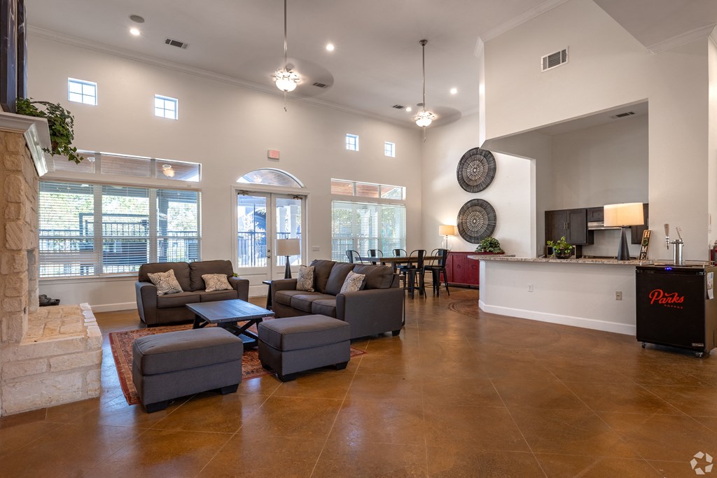A living room with a fireplace and a large couch.