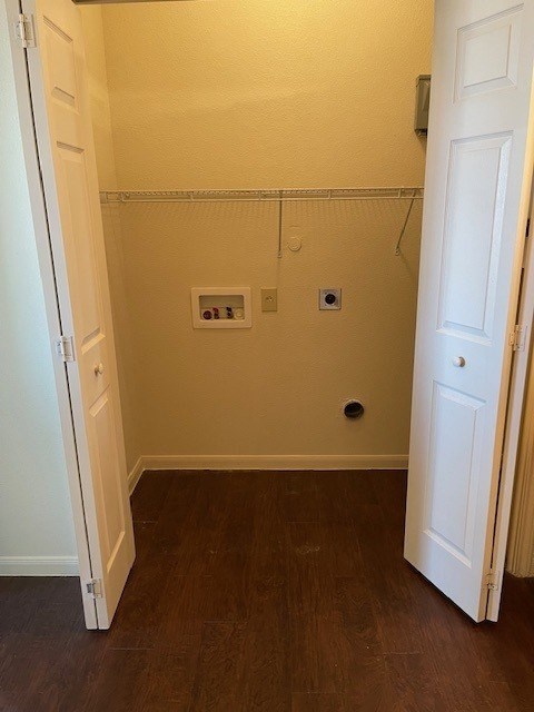 A small bathroom with a toilet and a shower.