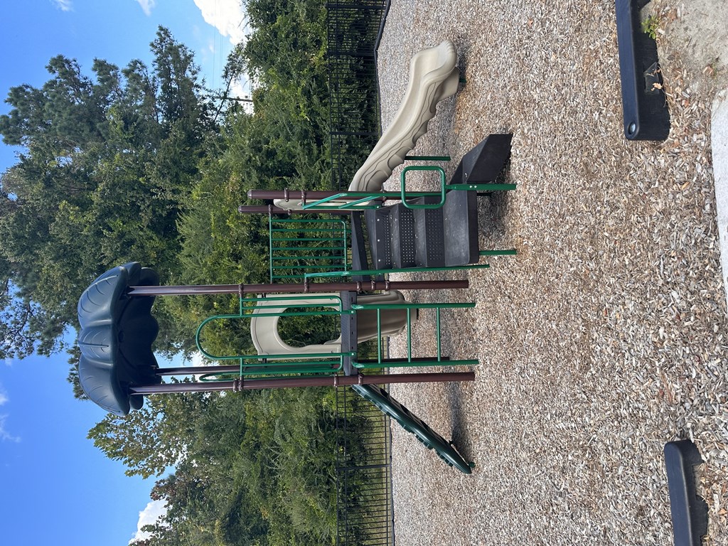 an aerial view of a table and chairs on a roof