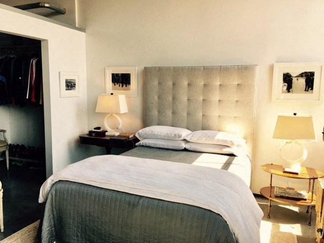 a bedroom with a bed and a closet