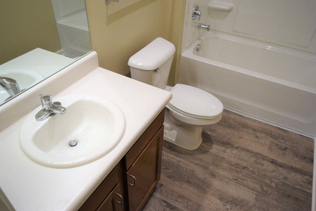 an image of a bathroom with a sink toilet and bath tub