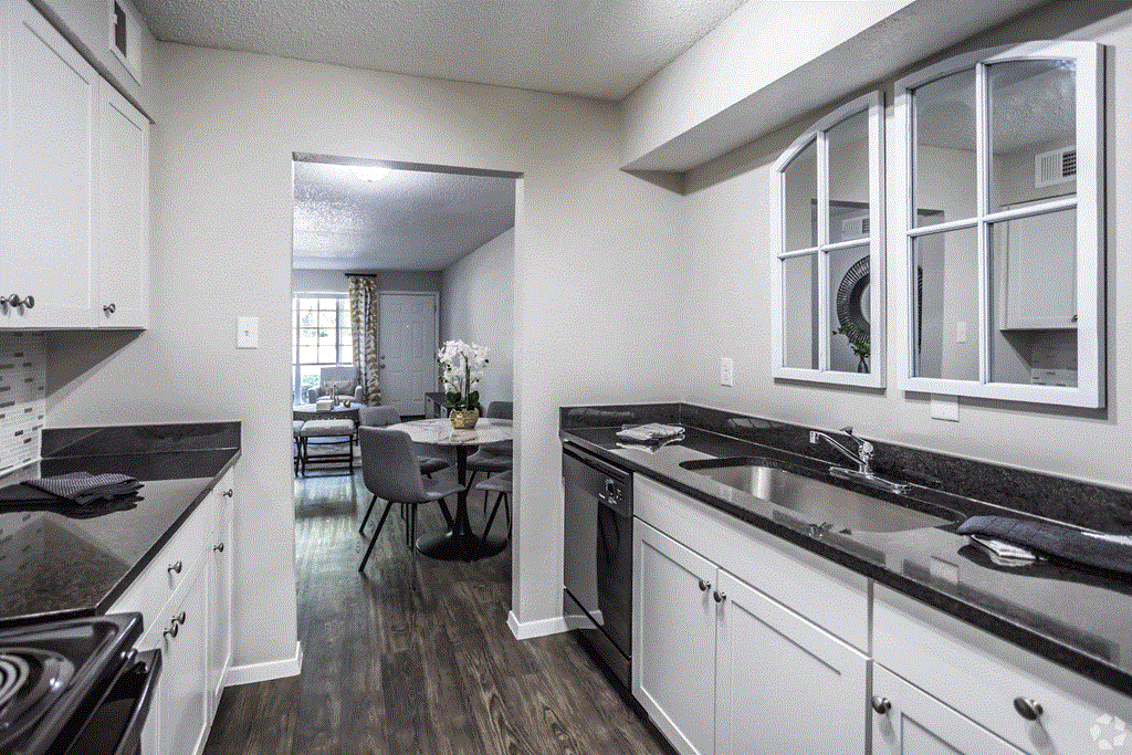 a kitchen and dining area in a 555 waverly unit at Azure Place Apartments, Memphis, 38118