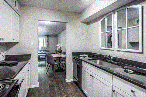 a kitchen and dining area in a 555 waverly unit